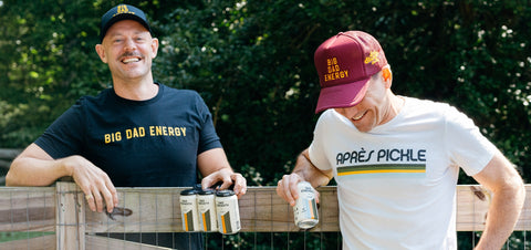 Dad Strength founders Craig and Ryan sharing Dad Strength IPA outdoors