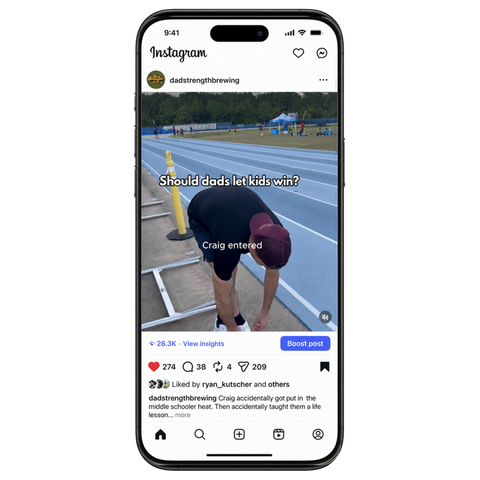 A smartphone mockup displaying an Instagram post on a clean white background. The post shows a person on a track field with the text 'Should dads let kids win?' and the handle 'dadstrengthening'.